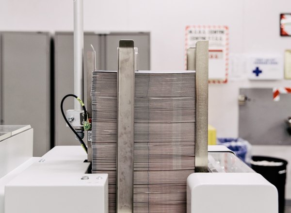 Passports stacked in a machine before being completely assembled